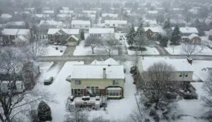Indianapolis winter exterior damage visible on snow-covered neighborhood homes