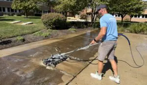 Concrete cleaning as part of preventative exterior cleaning for protecting home surfaces