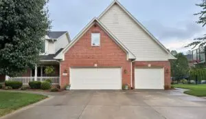 Clean brick home and driveway after a professional house wash
