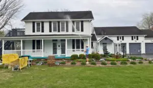 Professional house washing service using soft washing methods for exterior cleaning