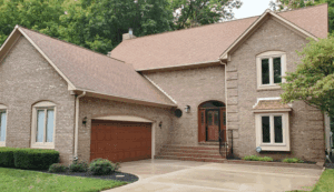 Brick house after annual exterior house washing, showing clean siding and driveway